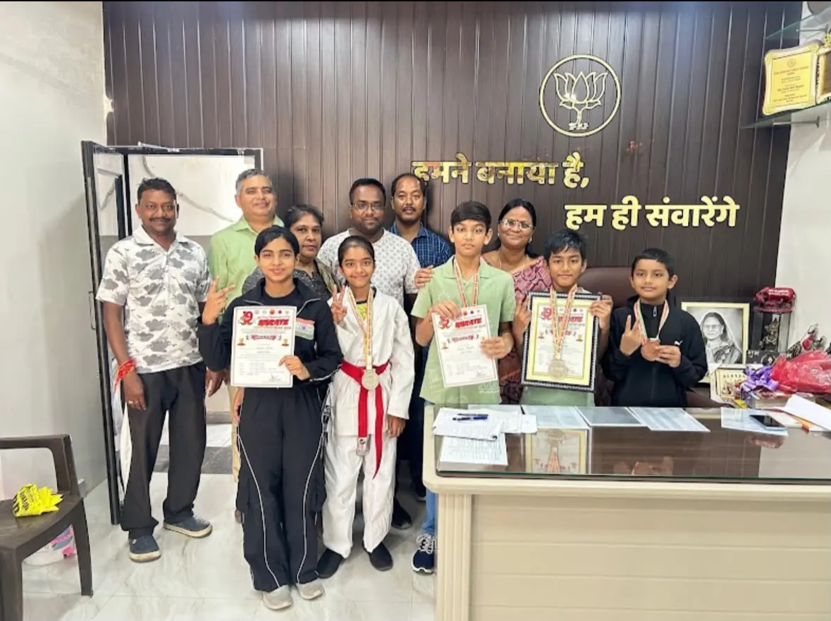 Students and guests with certificates at a visit